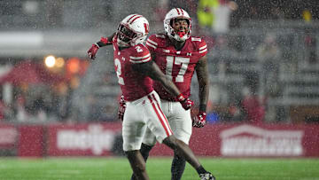Nov 8, 2025; Madison, Wisconsin, USA;  Wisconsin Badgers linebacker Darryl Peterson III (17) and cornerback Ricardo Hallman (2) celebrate following a play during the fourth quarter against the Washington Huskies at Camp Randall Stadium. Mandatory Credit: Jeff Hanisch-Imagn Images