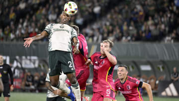 Aug 24, 2024; Portland, Oregon, USA; Portland Timbers defender Miguel Araujo (2) heads the ball against St. Louis CITY SC defender Henry Kessler (5) in the second half at Providence Park. Mandatory Credit: Troy Wayrynen-USA TODAY Sports