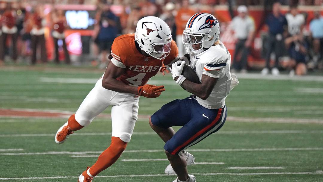 Texas Longhorns defensive back Jelani McDonald (4) hits UTSA Roadrunners running back Will Henderson III (1) for a tackle during the first half at Darrell K Royal-Texas Memorial Stadium. Texas Longhorns defensive back Jelani McDonald (4) hits UTSA Roadrunners running back Will Henderson III (1) for a tackle during the first half at Darrell K Royal-Texas Memorial Stadium.