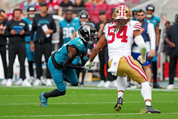 Jacksonville Jaguars wide receiver Travis Hunter (12) runs after San Francisco 49ers linebacker Fred Warner (54).