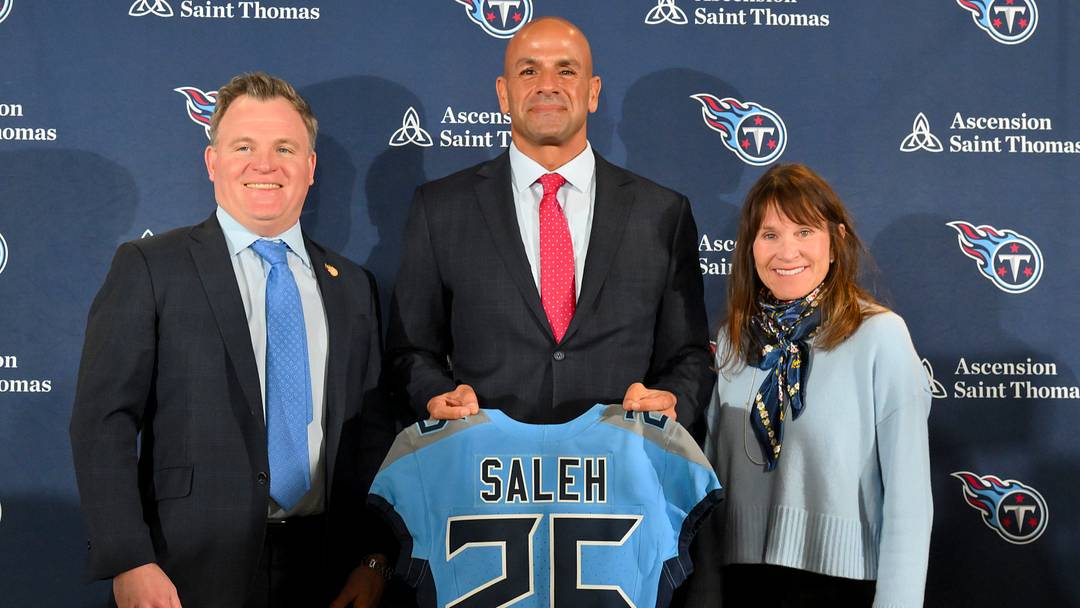Jan 29, 2026; Nashville, TN, USA;  Tennessee Titans owner Amy Adams Strunk, general manager Mike Borgonzi and head coach Robert Saleh holds up the Titans jersey during the press conference at Ascension Saint Thomas Sports Park. Mandatory Credit: Steve Roberts-Imagn Images