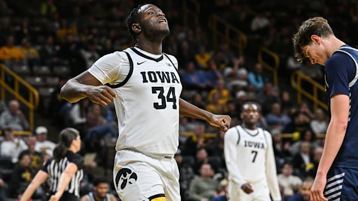 Dec 30, 2024; Iowa City, Iowa, USA; Iowa Hawkeyes forward Chris Tadjo (34) reacts against the New Hampshire Wildcats during the first half at Carver-Hawkeye Arena. Mandatory Credit: Jeffrey Becker-Imagn Images