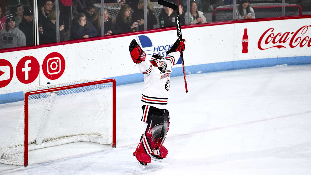 Lisa Jönsson jumps after Northeastern secure a victory.