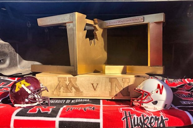 The $5 Bits of Broken Chair Trophy with mini helmets for Minnesota and Nebraska.