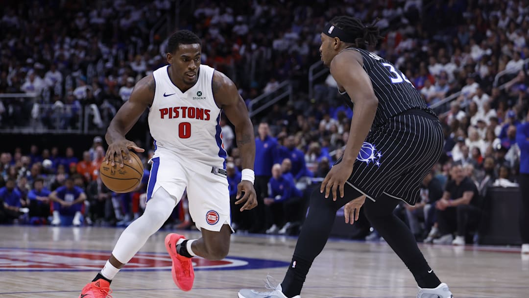 Apr 19, 2026; Detroit, Michigan, USA; Detroit Pistons center Jalen Duren (0) dribbles defended by Orlando Magic center Wendell Carter Jr. (34) in the second half during the 2026 NBA Playoffs at Little Caesars Arena. Mandatory Credit: Rick Osentoski-Imagn Images