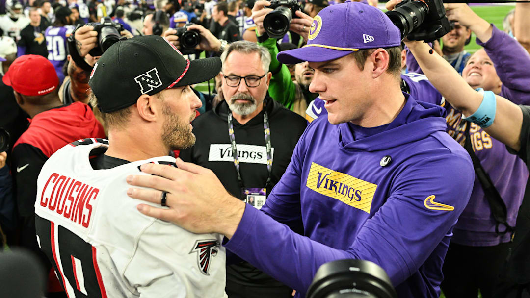 Dec 8, 2024; Minneapolis, Minnesota, USA; Atlanta Falcons quarterback Kirk Cousins (18) and Minnesota Vikings head coach Kevin O'Connell talk after the game at U.S. Bank Stadium.