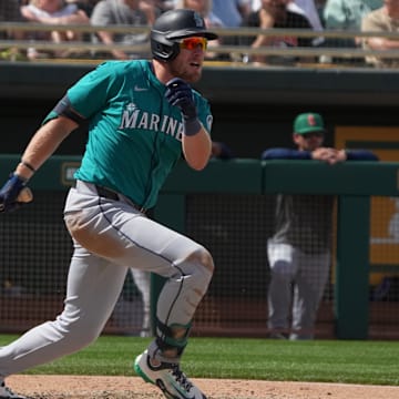 Seattle Mariners outfielder Luke Raley hits an RBI triple during a spring training game against the Athletics on March 17 at Hohokam Stadium.
