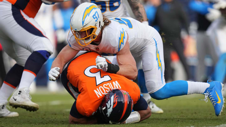 Jan 8, 2023; Denver, Colorado, USA; Los Angeles Chargers linebacker Joey Bosa (97) sacks Denver Broncos quarterback Russell Wilson (3) in the second quarter at Empower Field at Mile High. Mandatory Credit: Ron Chenoy-USA TODAY Sports