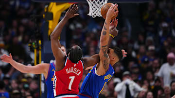 Apr 19, 2025; Denver, Colorado, USA; LA Clippers guard James Harden (1) and Denver Nuggets forward Michael Porter Jr. (1) reach for the ball in the second half at Ball Arena. Mandatory Credit: Ron Chenoy-Imagn Images