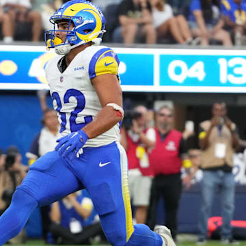 Aug 9, 2025; Inglewood, California, USA; Los Angeles Rams running back Cody Schrader (32) scores on a 9-yard touchdown reception in the fourth quarter against the Dallas Cowboys at SoFi Stadium. Mandatory Credit: Kirby Lee-Imagn Images