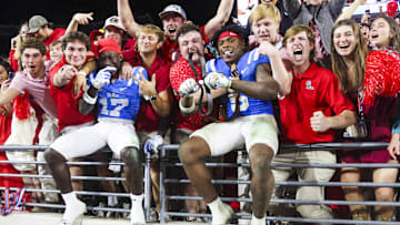 Nov 15, 2025; Oxford, Mississippi, USA; Mississippi Rebels wide receiver Winston Watkins (17) and running back Kewan Lacy (5) react with fans after defeating the Florida Gators at Vaught-Hemingway Stadium. Mandatory Credit: Petre Thomas-Imagn Images