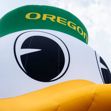 An inflatable of the University of Oregon Duck mascot floats on the White River in front of the NCAA Headquarters on Tuesday, July 23, 2024, in downtown Indianapolis. The float weighs in at 1,600 pounds and takes 1.5 hours to inflate.