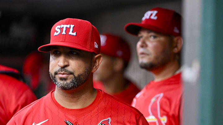 Aug 8, 2025; St. Louis, Missouri, USA; St. Louis Cardinals manager Oliver Marmol (37) and guest coach Yadier Molina (4) look on from the dugout before a game against the Chicago Cubs at Busch Stadium. Mandatory Credit: Jeff Curry-Imagn Images