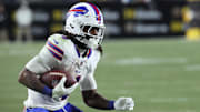 Nov 30, 2025; Pittsburgh, Pennsylvania, USA; Buffalo Bills running back James Cook III (4) rushes during the fourth quarter against the Pittsburgh Steelers at Acrisure Stadium. Mandatory Credit: Charles LeClaire-Imagn Images