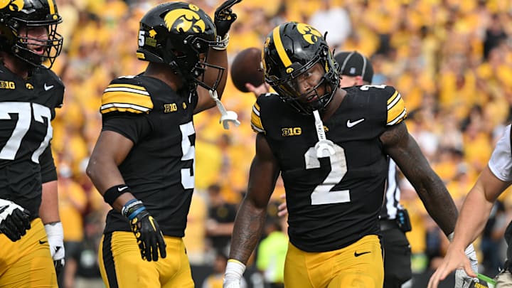 Sep 14, 2024; Iowa City, Iowa, USA; Iowa Hawkeyes running back Kaleb Johnson (2) reacts with wide receiver Jacob Gill (5) after running for a 4 yard touchdown against the Troy Trojans during the second quarter at Kinnick Stadium.