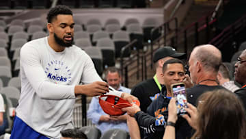 Mar 19, 2025; San Antonio, Texas, USA; New York Knicks forward Karl-Anthony Towns (32) signs autographs for fans before a game against the San Antonio Spurs at Frost Bank Center. Mandatory Credit: Scott Wachter-Imagn Images