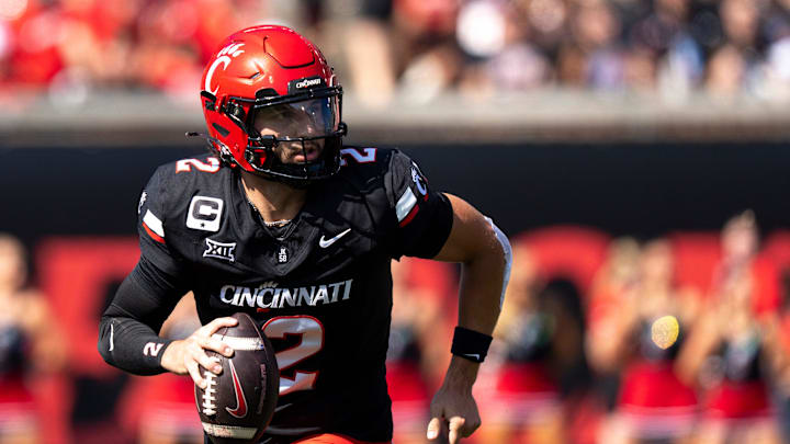 Cincinnati Bearcats quarterback Brendan Sorsby (2) rolls out of the pocket in the first quarter of the NCAA football game between the Cincinnati Bearcats and Iowa State Cyclones at Nippert Stadium in Cincinnati on Oct. 4, 2025.