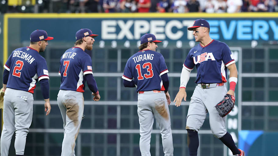 Team USA baseball players celebrate after a win over the Dominican Republic