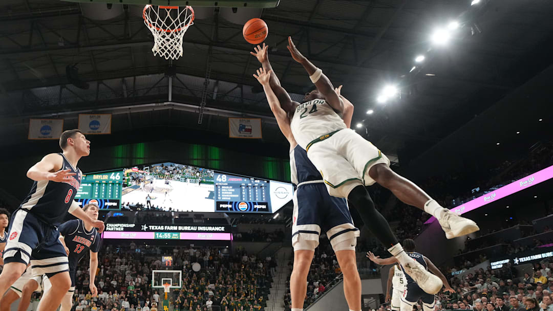 Feb 24, 2026; Waco, Texas, USA; Baylor Bears guard Tounde Yessoufou (24) scores a basket against Arizona Wildcats guard Anthony Dell'orso (3) during the second half at Paul and Alejandra Foster Pavilion. Mandatory Credit: Chris Jones-Imagn Images