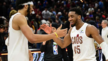 Jan 8, 2025; Cleveland, Ohio, USA; Cleveland Cavaliers guard Donovan Mitchell (45) celebrates with center Jarrett Allen (31) after the Cavaliers beat the Oklahoma City Thunder at Rocket Mortgage FieldHouse. Mandatory Credit: Ken Blaze-Imagn Images