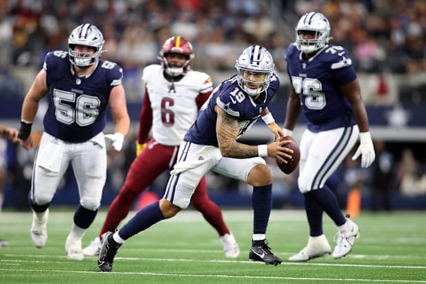 Dallas Cowboys quarterback Trey Lance scrambles in the pocket against the Washington Commanders.