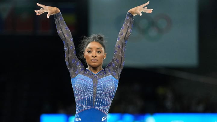 Simone Biles competes on the beam in the women's gymnastics all-around during the Paris 2024 Olympic Summer Games at Bercy Arena on August 1, 2024.