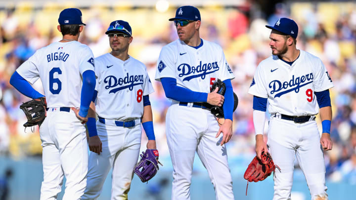 Jul 21, 2024; Los Angeles, California, USA; Los Angeles Dodgers second base Cavan Biggio (6), third baseman Enrique Hernández (8), first baseman Freddie Freeman (5), and second baseman Gavin Lux (9) meet on the field against the Boston Red Sox during the sixth inning at Dodger Stadium. Mandatory Credit: Jonathan Hui-USA TODAY Sports