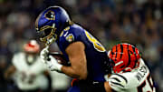 Baltimore Ravens tight end Charlie Kolar (88) is tackled by Cincinnati Bengals linebacker Logan Wilson (55) in the second quarter of the NFL game at M&T Banks Stadium in Baltimore on Thursday, Nov. 7, 2024.