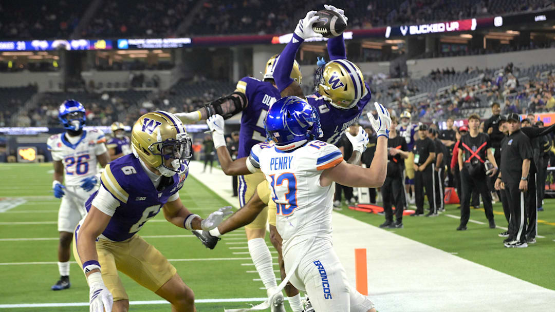 Dec 13, 2025; Inglewood, CA, USA;  Washington Huskies cornerback Leroy Bryant (0) intercepts a pass in the end zone intended for Boise State Broncos wide receiver Chase Penry (13) in the second half of the LA Bowl at SoFi Stadium. Mandatory Credit: Jayne Kamin-Oncea-Imagn Images