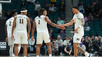 Nov 26, 2025; Las Vegas, NV, USA; Michigan Wolverines guard Trey McKenney (1) celebrates with forward Yaxel Lendeborg (23) in the second half against the Gonzaga Bulldogs in the 2025 Players Era Festival championship game at MGM Grand Garden Arena. Mandatory Credit: Kirby Lee-Imagn Images