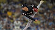 Jul 22, 2025; Los Angeles, California, USA;  Minnesota Twins relief pitcher Griffin Jax (22) delivers to the plate during the seventh inning against the Los Angeles Dodgers at Dodger Stadium. Mandatory Credit: Jayne Kamin-Oncea-Imagn Images