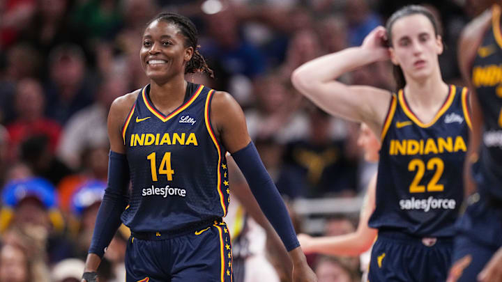 Indiana Fever center Temi Fagbenle (14) smiles after a foul called on her on Sunday, Sept. 15, 2024, during the game at Gainbridge Fieldhouse in Indianapolis. The Indiana Fever defeated the Dallas Wings, 110-109. Indiana Fever center Temi Fagbenle (14) smiles after a foul called on her on Sunday, Sept. 15, 2024, during the game at Gainbridge Fieldhouse in Indianapolis. The Indiana Fever defeated the Dallas Wings, 110-109.