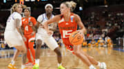 Mar 26, 2023; Greenville, SC, USA; Miami Hurricanes guard Hanna Cavinder (15) drives to the basket against the LSU Lady Tigers during the second half of the NCAA Women   s Tournament at Bon Secours Wellness Arena. Mandatory Credit: Jim Dedmon-Imagn Images
