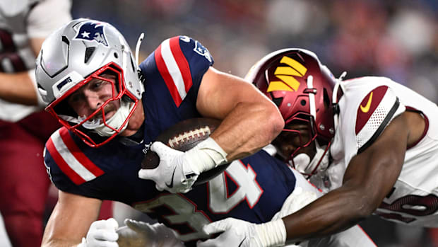 New England Patriots running back Lan Larison (34) rushes against the Washington Commanders.