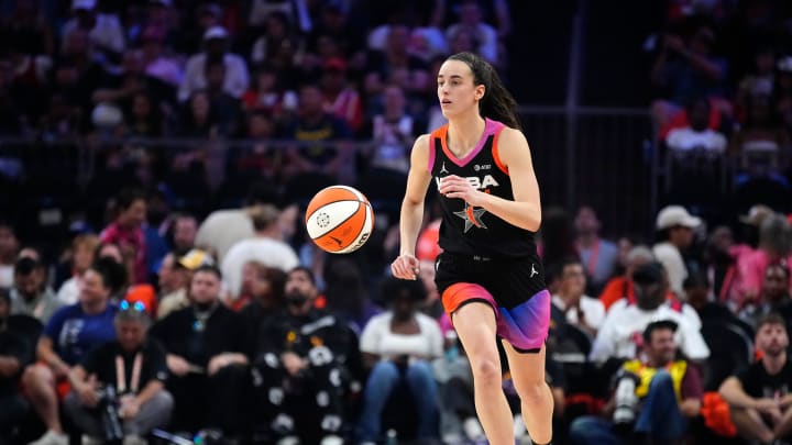 Team WNBA guard Caitlin Clark dribbles up the court against Team USA during the WNBA All-Star Game at Footprint Center in Phoenix on July 20, 2024.