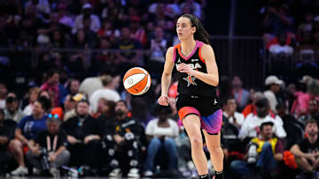 Team WNBA guard Caitlin Clark dribbles up the court against Team USA during the WNBA All-Star Game.