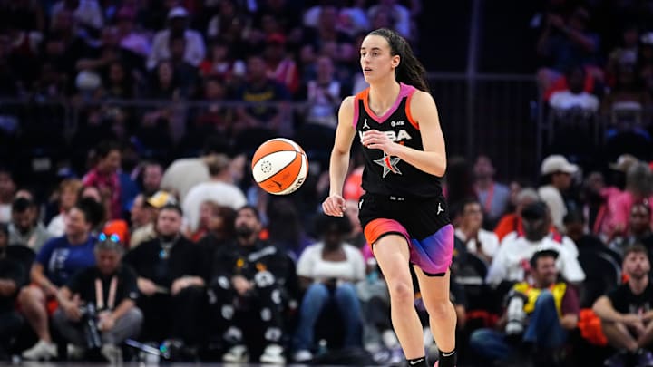 Team WNBA guard Caitlin Clark dribbles up the court against Team USA during the WNBA All-Star Game. Team WNBA guard Caitlin Clark dribbles up the court against Team USA during the WNBA All-Star Game.