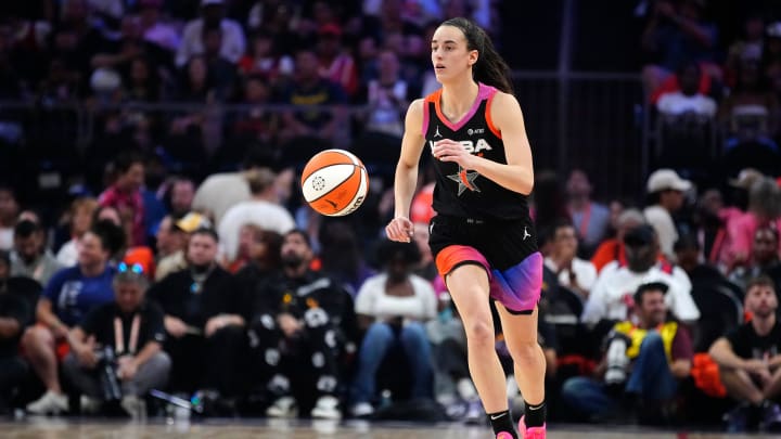 Team WNBA guard Caitlin Clark dribbles up the court against Team USA during the WNBA All-Star Game at Footprint Center.