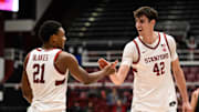 Jan 22, 2025; Stanford, California, USA; Stanford Cardinal forward Maxime Raynaud (42) and guard Jaylen Blakes (21) celebrate against the Miami (FL) Hurricanes in the second half at Maples Pavilion. Mandatory Credit: Eakin Howard-Imagn Images