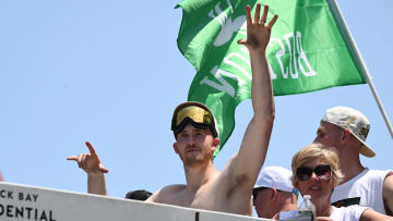 Jun 21, 2024; Boston, MA, USA; Boston Celtics forward Sam Hauser (30) waves to the crowd during the 2024 NBA Championship parade in Boston. Mandatory Credit: Brian Fluharty-USA TODAY Sports