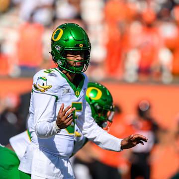 Sep 14, 2024; Corvallis, Oregon, USA; Oregon Ducks quarterback Dante Moore (5) calls a play during the second half against the Oregon State Beavers at Reser Stadium. Mandatory Credit: Craig Strobeck-Imagn Images
