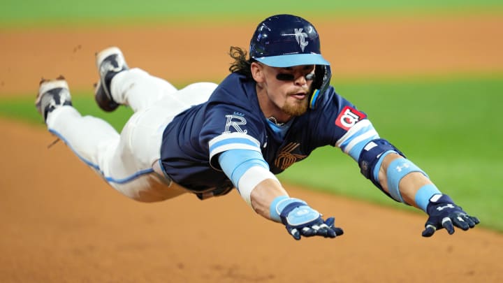 Jun 7, 2024; Kansas City, Missouri, USA; Kansas City Royals shortstop Bobby Witt Jr. (7) slides into third base for a triple during the ninth inning against the Seattle Mariners at Kauffman Stadium. Mandatory Credit: Jay Biggerstaff-USA TODAY Sports Jun 7, 2024; Kansas City, Missouri, USA; Kansas City Royals shortstop Bobby Witt Jr. (7) slides into third base for a triple during the ninth inning against the Seattle Mariners at Kauffman Stadium. Mandatory Credit: Jay Biggerstaff-USA TODAY Sports