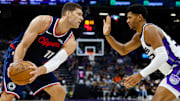 Oct 15, 2025; Sacramento, California, USA; Los Angeles Clippers center Brook Lopez (11) controls the ball against Sacramento Kings center Dylan Cardwell (32) during the fourth quarter at Golden 1 Center. Mandatory Credit: Sergio Estrada-Imagn Images