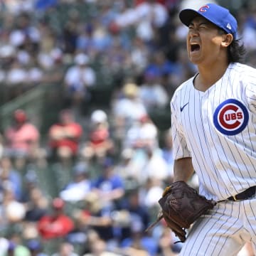 Jun 15, 2024; Chicago, Illinois, USA;  Chicago Cubs pitcher Shota Imanaga (18) reacts after he delivers a pitch during the first inning against the St. Louis Cardinals at Wrigley Field.