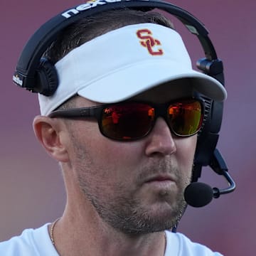 Oct 21, 2023; Los Angeles, California, USA; Southern California Trojans head coach Lincoln Riley watches from the sidelines against the Utah Utes in the first half at United Airlines Field at Los Angeles Memorial Coliseum. Mandatory Credit: Kirby Lee-Imagn Images
