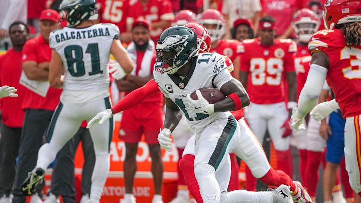 Sep 14, 2025; Kansas City, Missouri, USA; Philadelphia Eagles wide receiver A.J. Brown (11) runs the ball against the Kansas City Chiefs during the game at GEHA Field at Arrowhead Stadium. Mandatory Credit: Denny Medley-Imagn Images