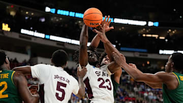 Mar 21, 2025; Raleigh, NC, USA; Mississippi State Bulldogs center Michael Nwoko (23) and Baylor Bears forward Norchad Omier (15) battle for the ball during the first half in the first round of the NCAA Tournament at Lenovo Center. Mandatory Credit: Bob Donnan-Imagn Images