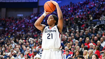 Nov 20, 2024; Storrs, Connecticut, USA; Connecticut Huskies forward Sarah Strong (21) shoots a three point basket during the second half against the Fairleigh Dickinson Knights at Harry A. Gampel Pavilion. Mandatory Credit: Mark Smith-Imagn Images
