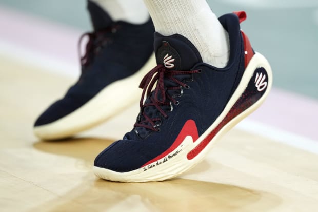 USA guard Stephen Curry's navy and white Under Armour shoes.