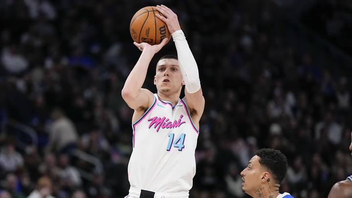 Feb 23, 2025; Milwaukee, Wisconsin, USA;  Miami Heat guard Tyler Herro (14) shoots during the fourth quarter against the Milwaukee Bucks at Fiserv Forum. Mandatory Credit: Jeff Hanisch-Imagn Images